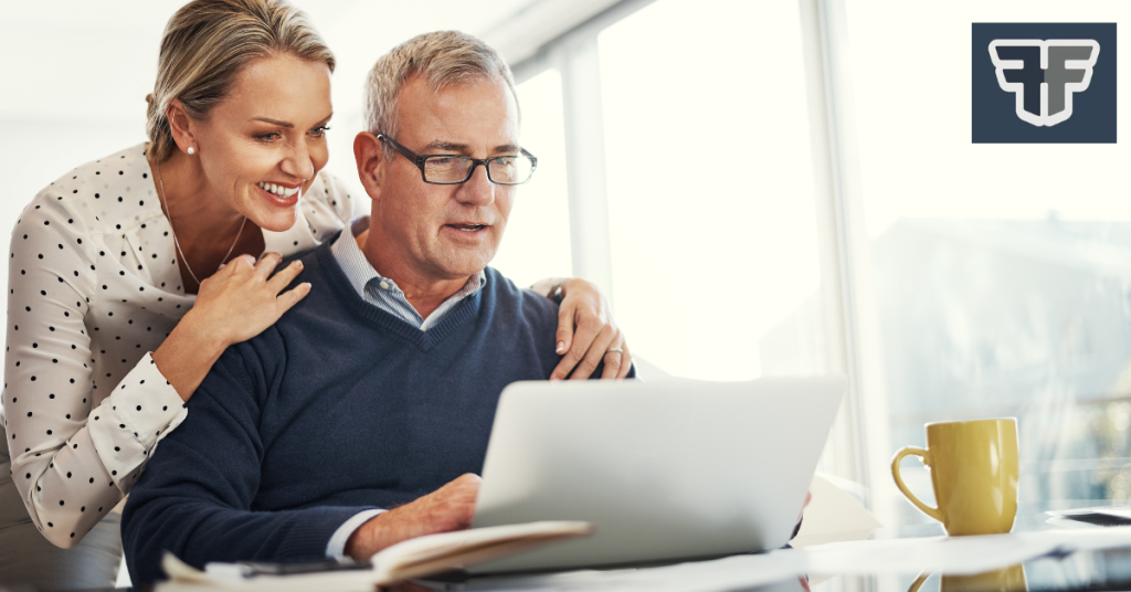 Image of a couple looking at a laptop to suggest they are planning for their retirement